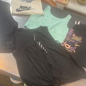 Five shirt selling as a bundle Nike and under Armour and one Lululemon